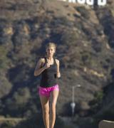 AMY WILLERTON in Short Shorts Jogging at Sunset Blvd in Los Angeles