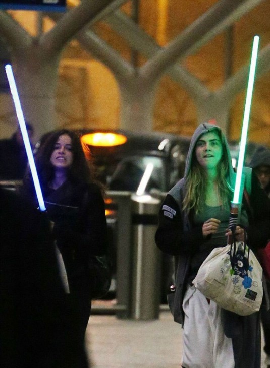 CARA DELEVINGNE and MICHELLE RODRIGUEZ at Paddington Station in London