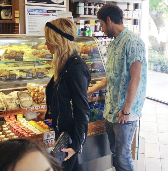 ASHLEY BENSON in Ripped Black Jeans Out Shopping in Hollywood